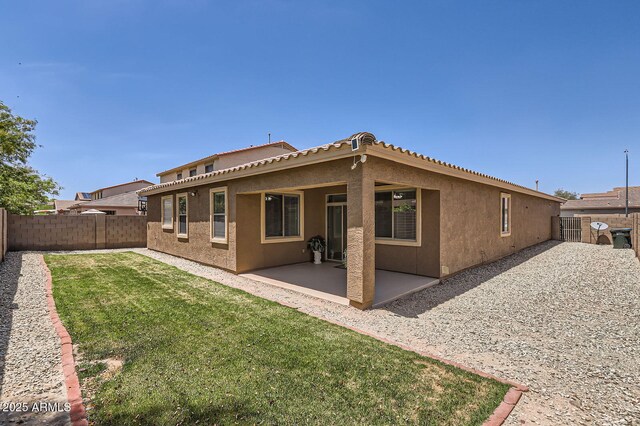 6815 W Carter Rd, Laveen, AZ 85339 - rear view of property with stucco siding, a patio, and a tiled roof