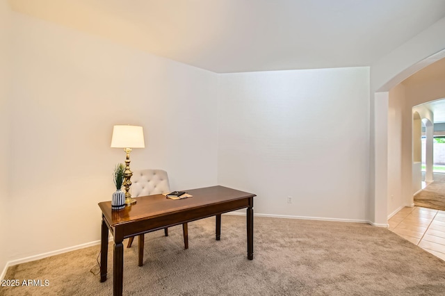 6815 W Carter Rd, Laveen, AZ 85339 - office space featuring arched walkways, light colored carpet, light tile patterned flooring, and baseboards