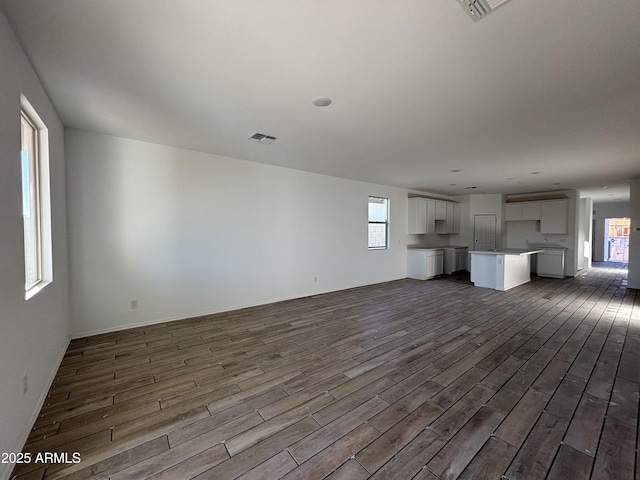 unfurnished living room with hardwood / wood-style floors