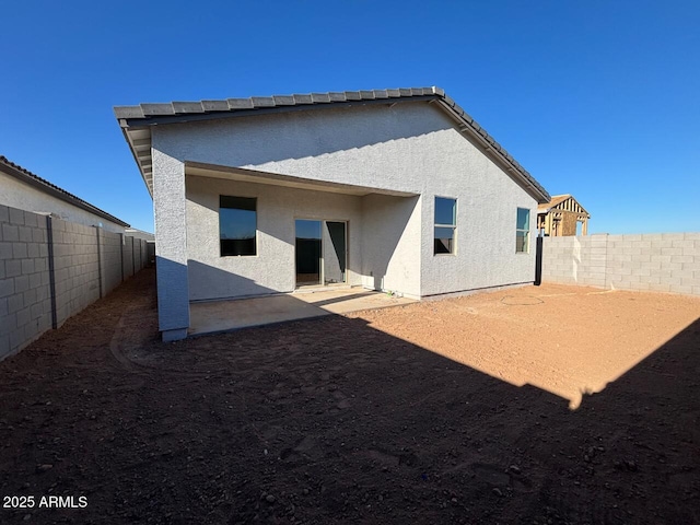 rear view of property with a patio area