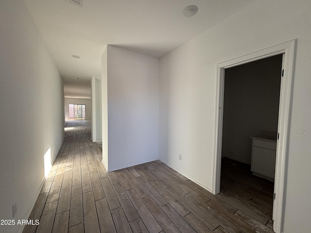 hall with dark hardwood / wood-style flooring