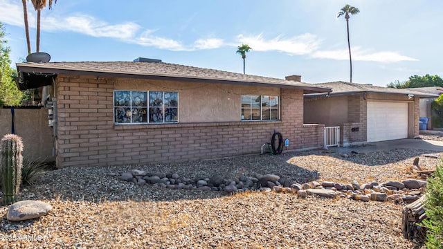 view of side of home featuring a garage