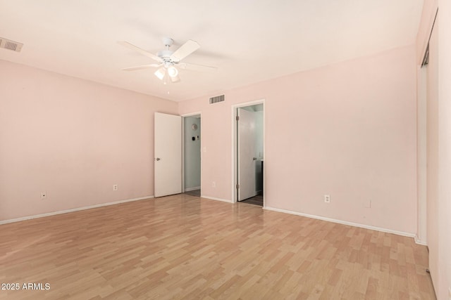 unfurnished bedroom with ceiling fan and light hardwood / wood-style flooring