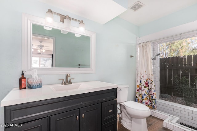 bathroom with vanity, hardwood / wood-style flooring, toilet, and a shower with shower curtain