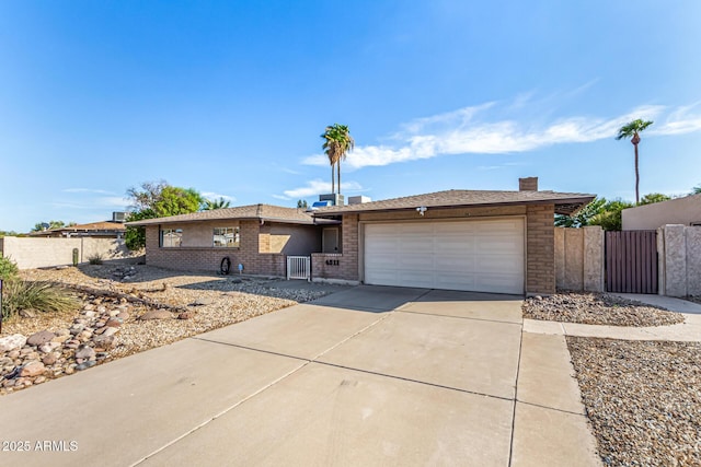 ranch-style home featuring a garage