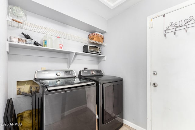 laundry area with separate washer and dryer