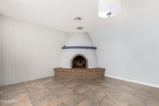 details with wooden walls and a fireplace