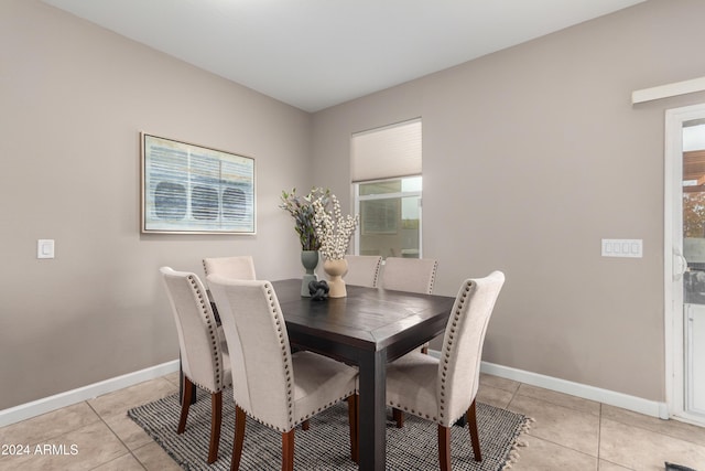 dining space featuring light tile patterned floors