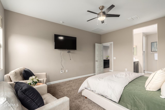 carpeted bedroom with ceiling fan and ensuite bathroom