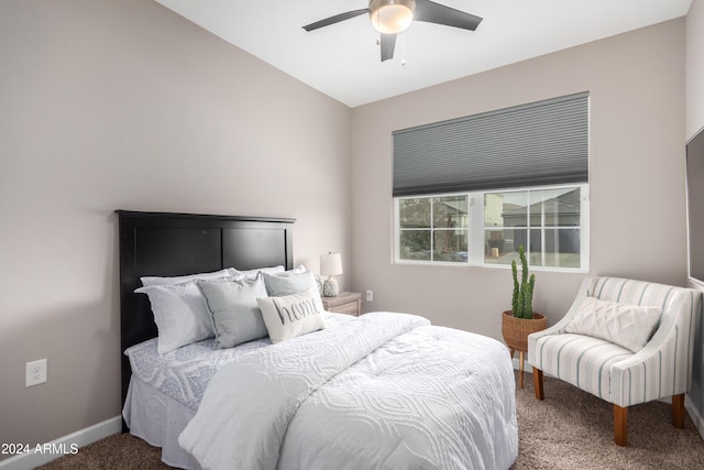 carpeted bedroom with ceiling fan and lofted ceiling