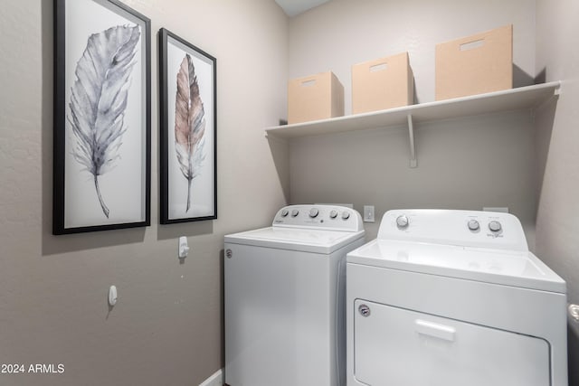 clothes washing area featuring washing machine and dryer