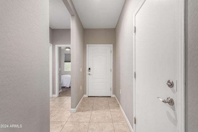 hallway featuring light tile patterned floors