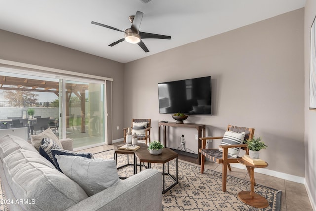 living room with ceiling fan and light tile patterned floors