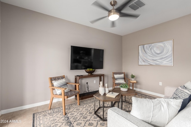 living room with light tile patterned floors and ceiling fan