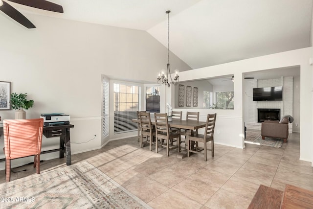 15621 S 37th Way, Phoenix, AZ 85048 - dining area with high vaulted ceiling, ceiling fan with notable chandelier, light tile patterned flooring, baseboards, and a brick fireplace