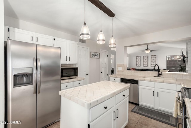 15621 S 37th Way, Phoenix, AZ 85048 - kitchen with tile counters, a sink, decorative backsplash, appliances with stainless steel finishes, and visible vents
