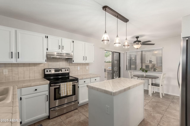 15621 S 37th Way, Phoenix, AZ 85048 - kitchen with stainless steel appliances, tile counters, under cabinet range hood, and tasteful backsplash