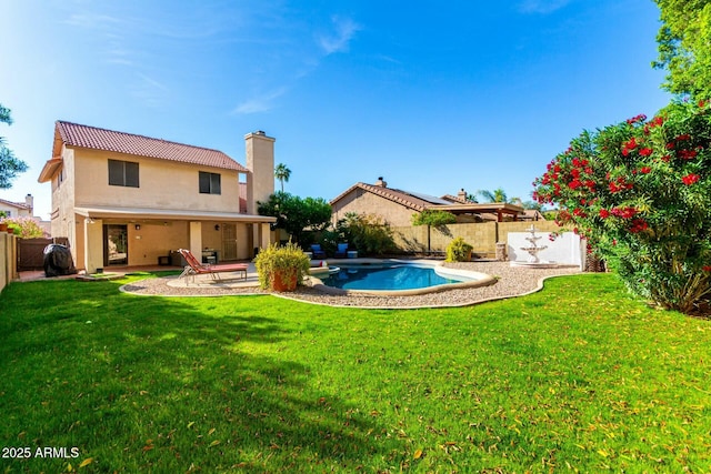 15621 S 37th Way, Phoenix, AZ 85048 - back of house featuring a fenced backyard, a fenced in pool, a yard, and a patio