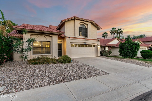 15621 S 37th Way, Phoenix, AZ 85048 - mediterranean / spanish house featuring stucco siding, an attached garage, driveway, and a tiled roof