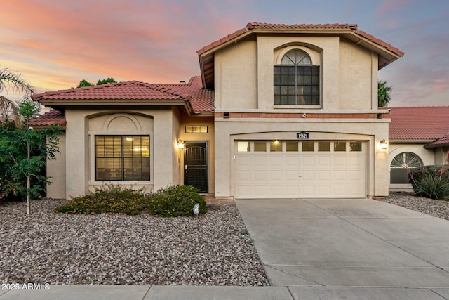 15621 S 37th Way, Phoenix, AZ 85048 - mediterranean / spanish home with an attached garage, a tiled roof, stucco siding, and driveway
