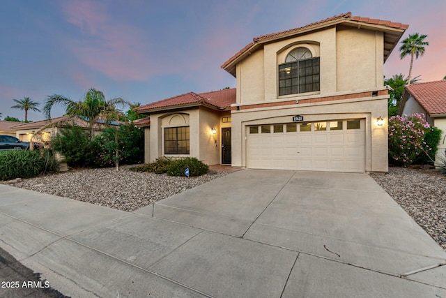15621 S 37th Way, Phoenix, AZ 85048 - mediterranean / spanish house with a garage, a tile roof, concrete driveway, and stucco siding