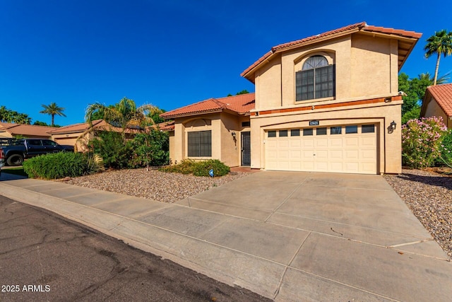 15621 S 37th Way, Phoenix, AZ 85048 - view of front facade with an attached garage, a tile roof, concrete driveway, and stucco siding
