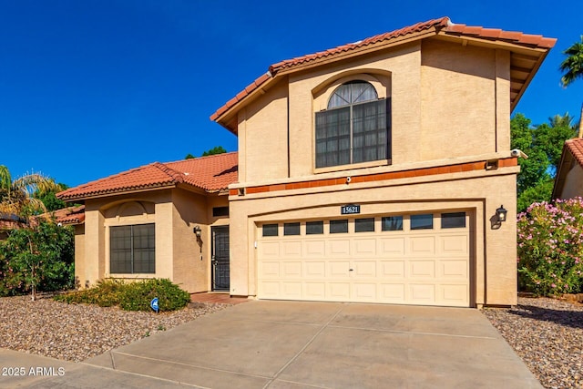 15621 S 37th Way, Phoenix, AZ 85048 - view of front of house featuring a garage, a tile roof, concrete driveway, and stucco siding