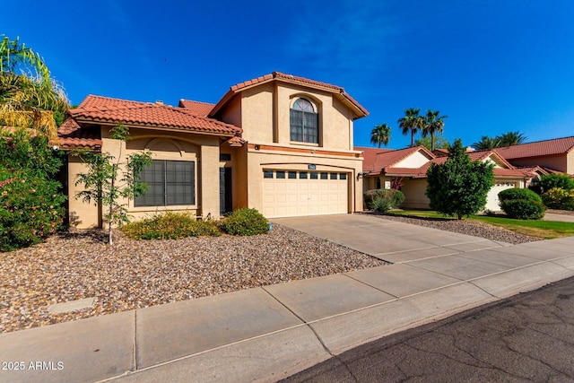 15621 S 37th Way, Phoenix, AZ 85048 - mediterranean / spanish house with stucco siding, a tile roof, concrete driveway, and an attached garage