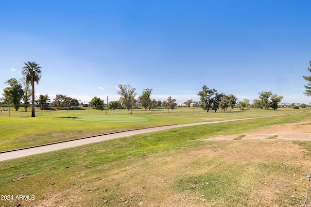 view of property's community featuring a lawn