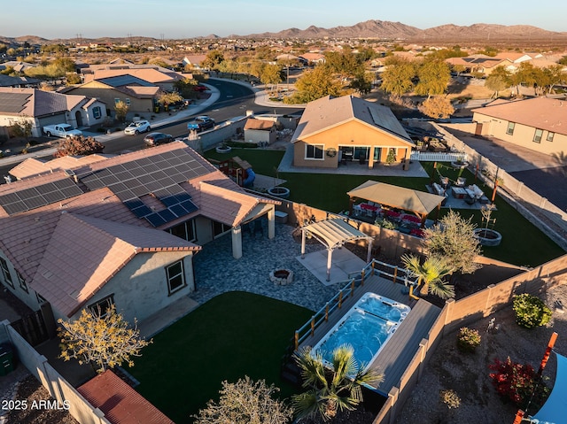 birds eye view of property featuring a mountain view