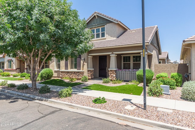 craftsman-style home featuring covered porch