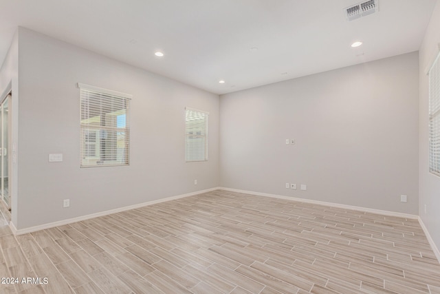 spare room featuring light hardwood / wood-style flooring