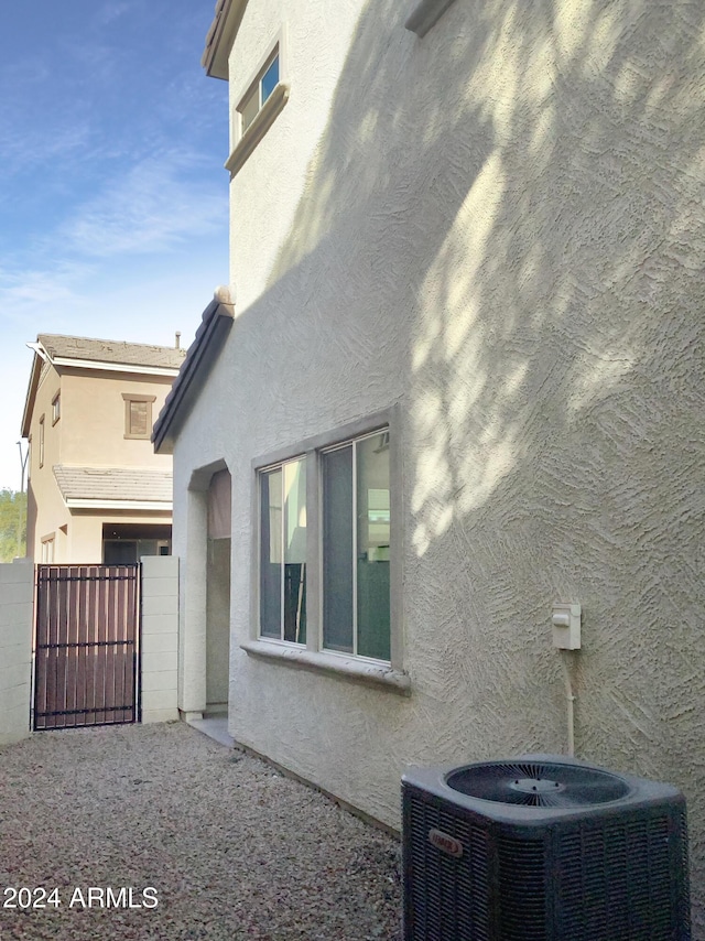 view of side of property featuring central AC unit