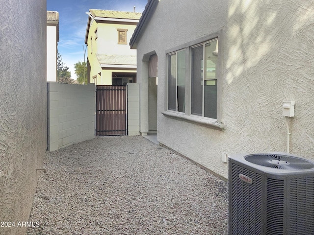 view of side of property with central AC