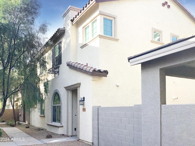 2550 N 149th Ave, Goodyear, AZ 85395 - view of side of property with a tiled roof and stucco siding