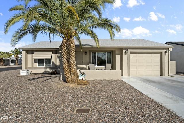 single story home featuring a garage, concrete driveway, a shingled roof, and stucco siding