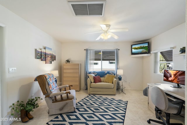 office area with baseboards, visible vents, and a ceiling fan