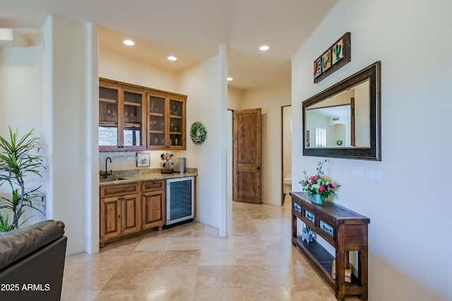 bar with a sink, indoor wet bar, wine cooler, and recessed lighting