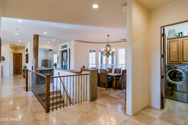 entryway with a notable chandelier, recessed lighting, and washer / clothes dryer