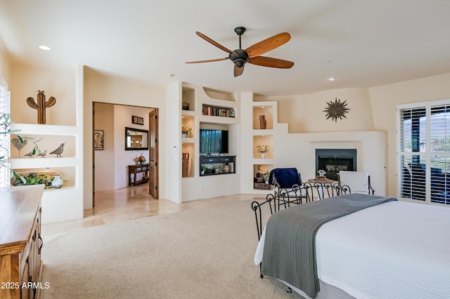 bedroom featuring recessed lighting, a fireplace, carpet flooring, and ceiling fan