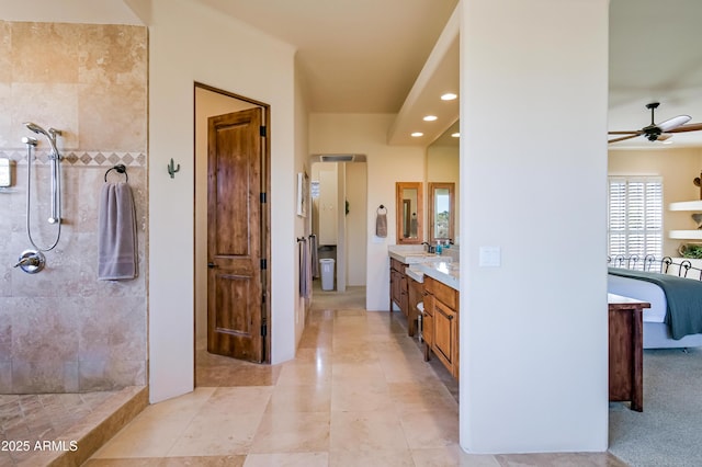 bathroom featuring vanity, a ceiling fan, tiled shower, recessed lighting, and tile patterned floors