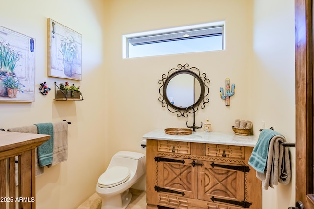 half bath with vanity and toilet