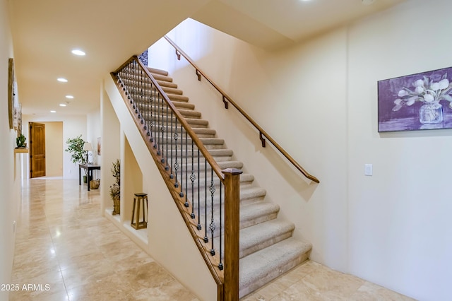 stairs featuring recessed lighting