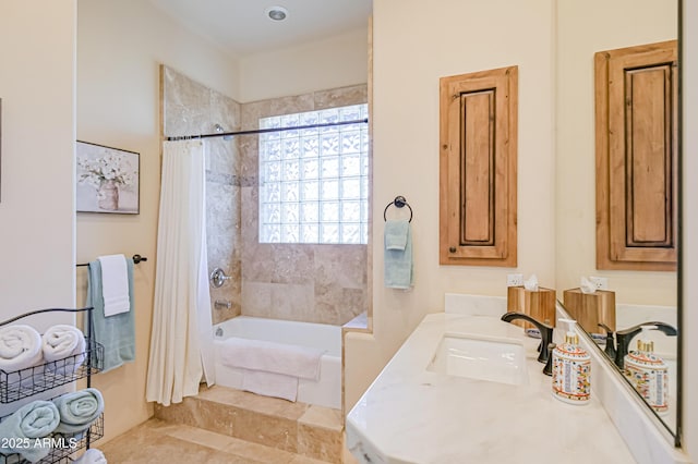 bathroom featuring vanity and shower / bath combo