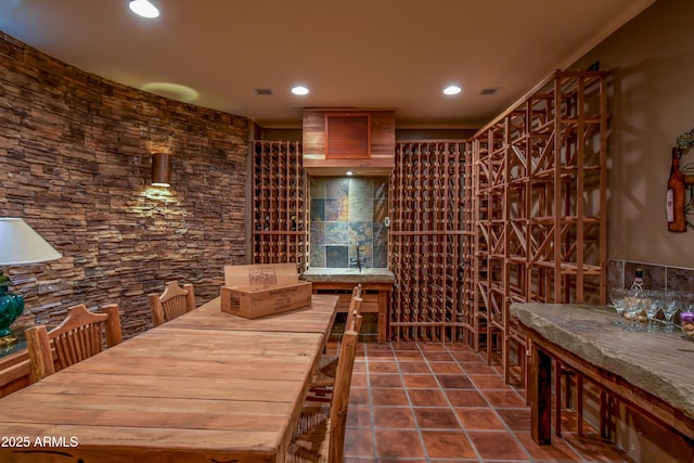 wine room featuring tile patterned floors, visible vents, and recessed lighting