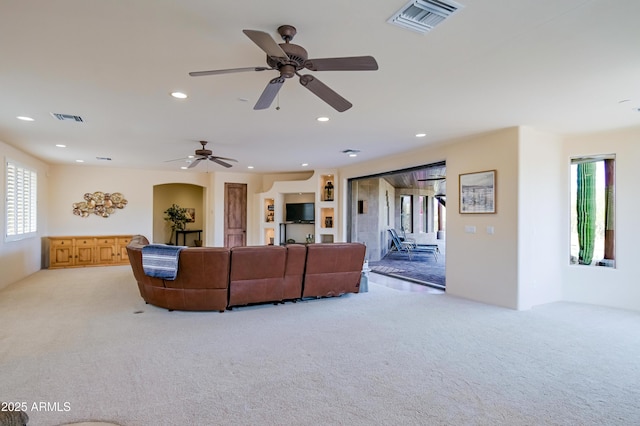 carpeted living area with a ceiling fan, recessed lighting, and visible vents