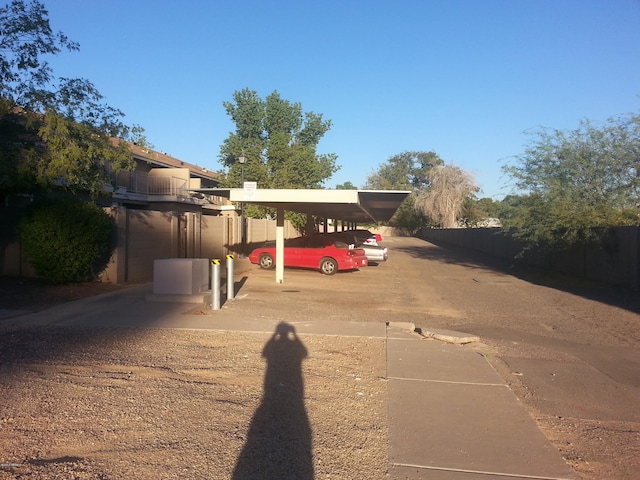 view of vehicle parking with a carport