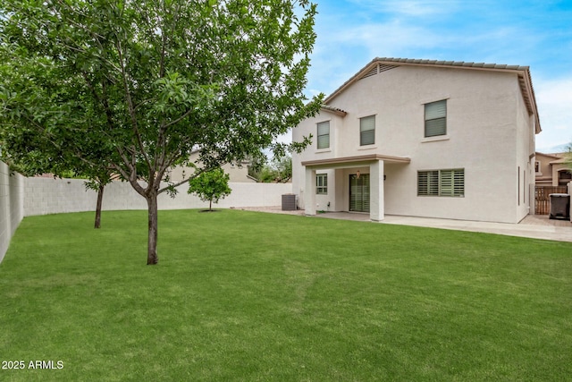 2438 W Via Dona Rd, Phoenix, AZ 85085 - back of property with stucco siding, a patio area, and central AC unit