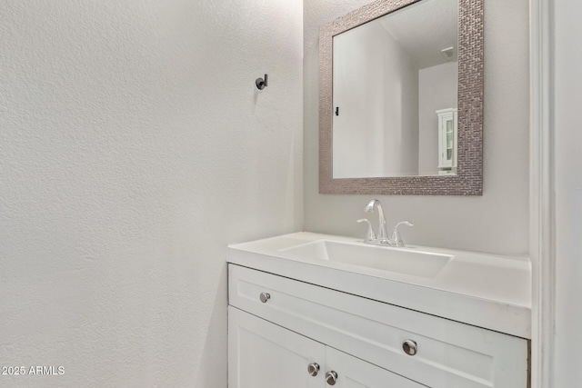 2438 W Via Dona Rd, Phoenix, AZ 85085 - bathroom featuring vanity and a textured wall