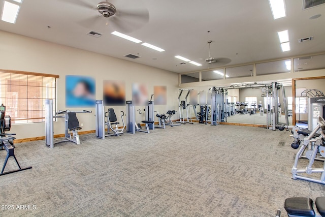 exercise room with a ceiling fan and visible vents